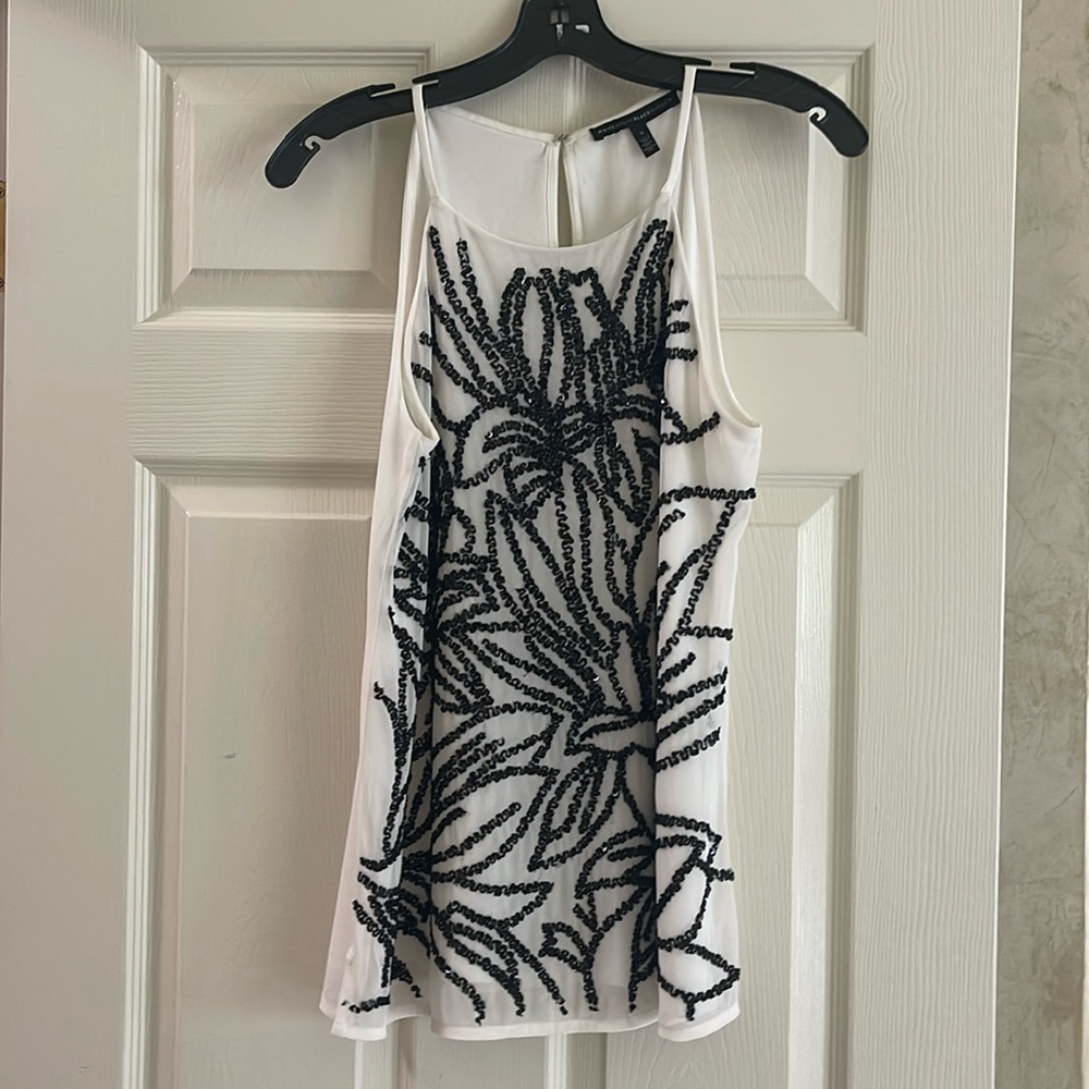 White House Black Market cream and black sleeveless dressy dress top.